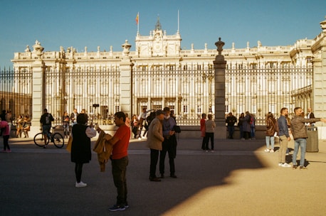 a group of people standing in front of a building