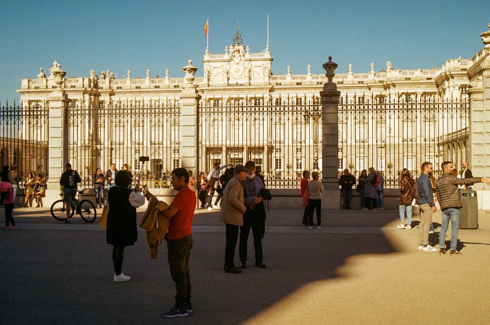 a group of people standing in front of a building