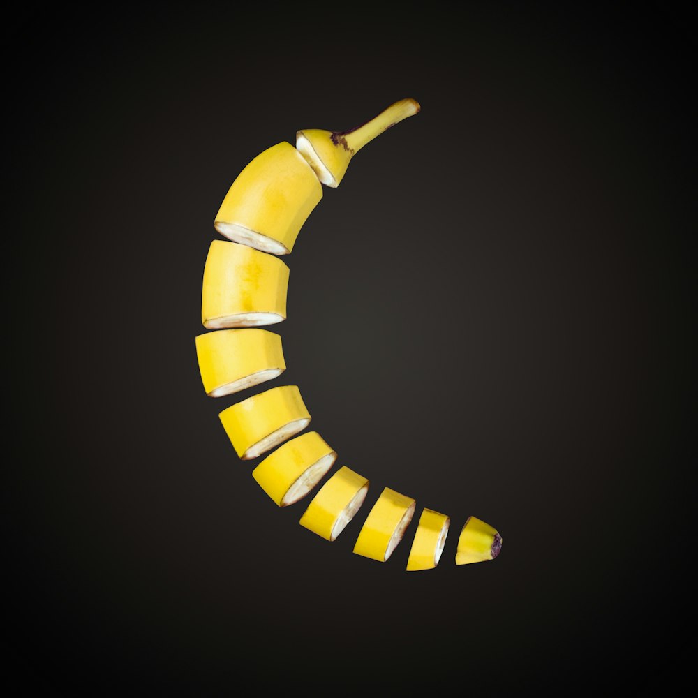 a banana shaped like a crescent on a black background