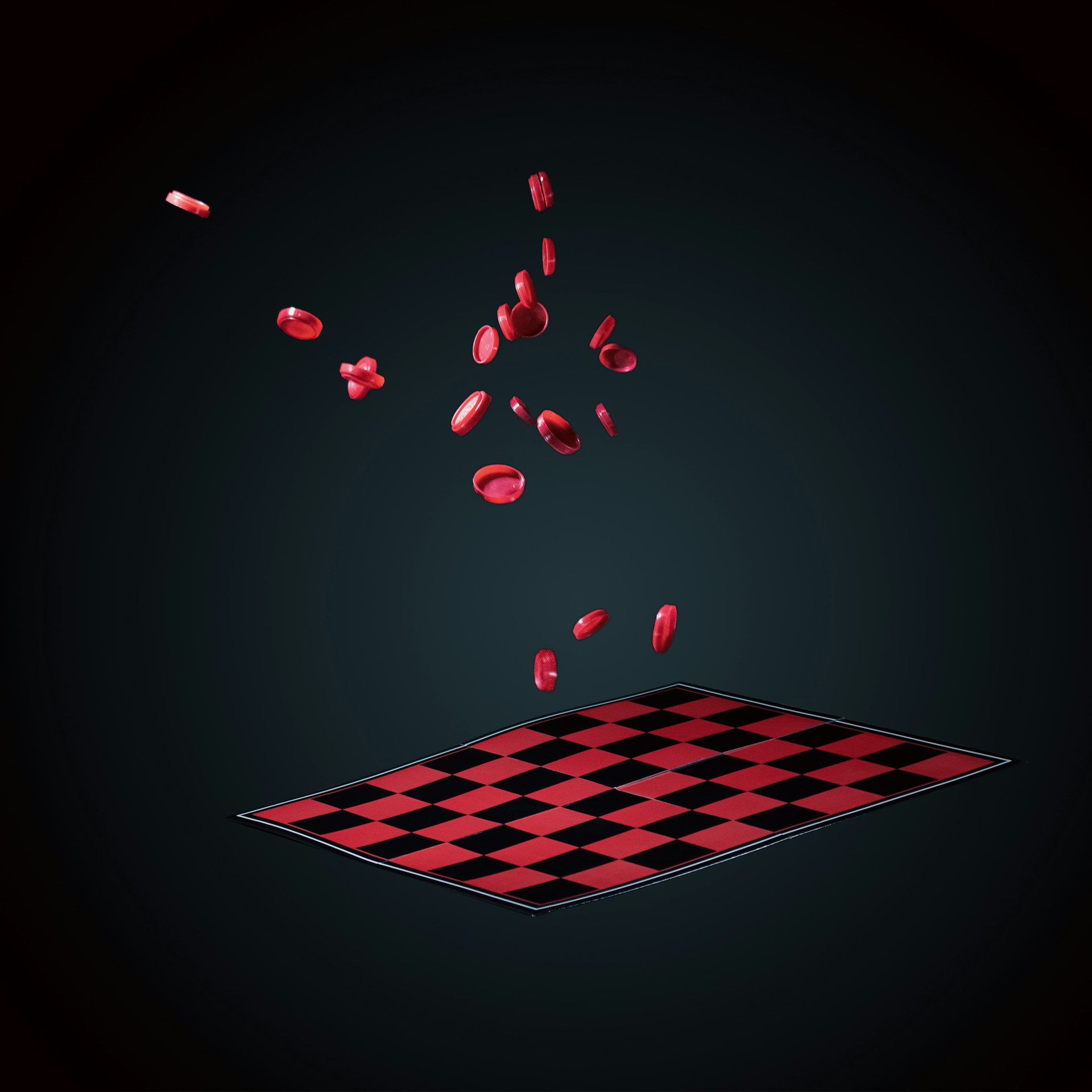 a black and red checkered rug with red petals coming out of it