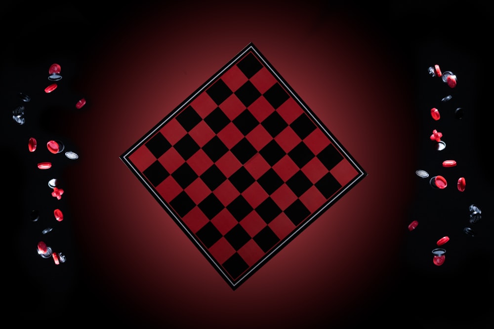 a black and red checkerboard pattern on a red background