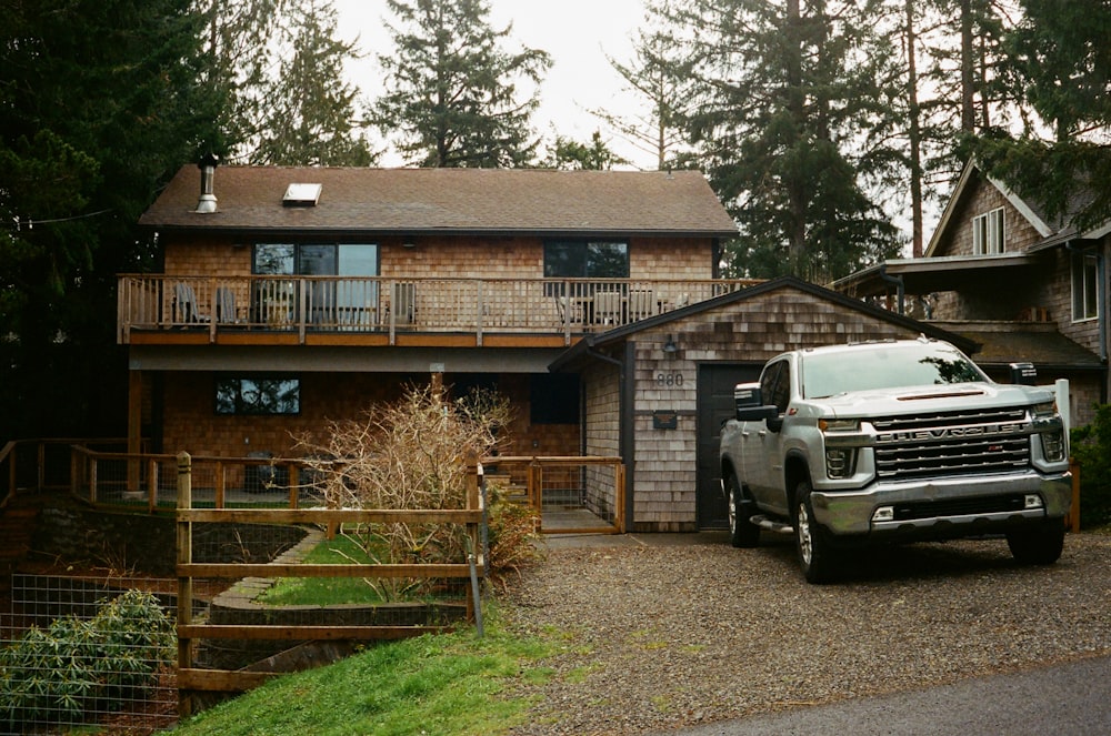 a truck is parked in front of a house