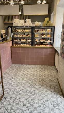 A cozy display of beautifully wrapped bakery gift boxes with coffee and books.