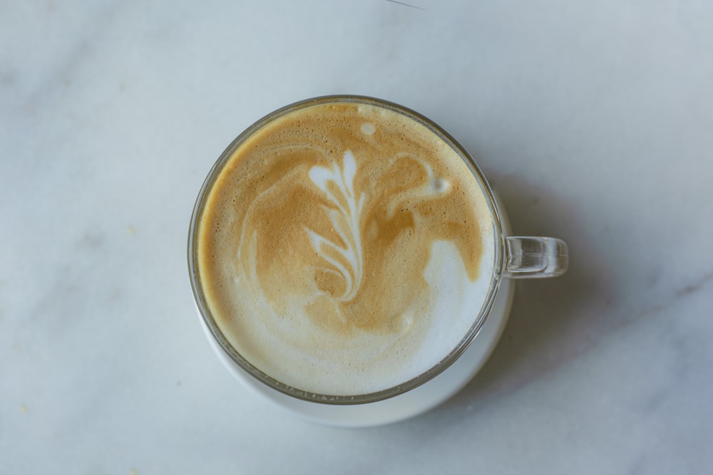 a cup of coffee on a marble table