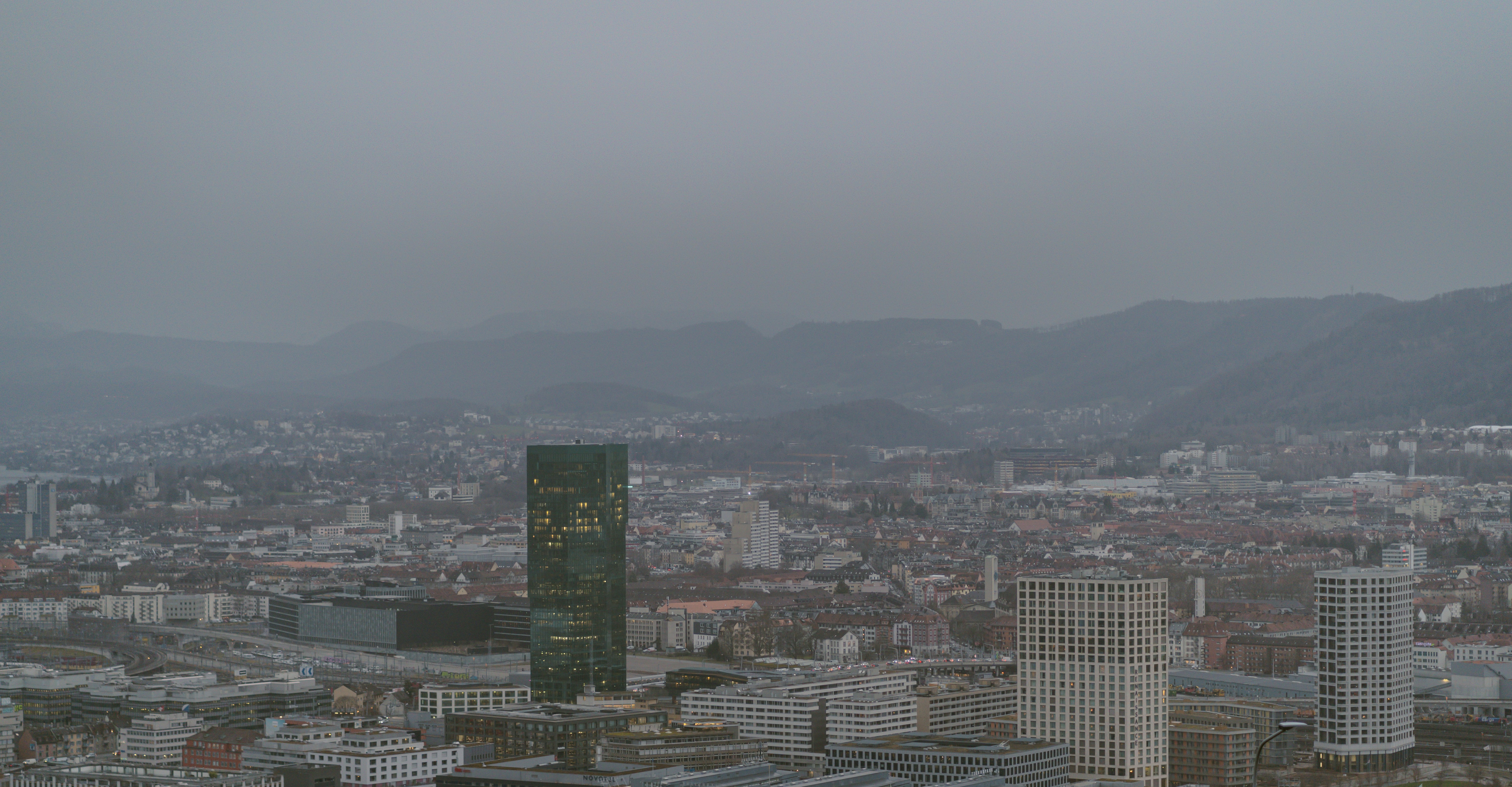 a view of a city with mountains in the background