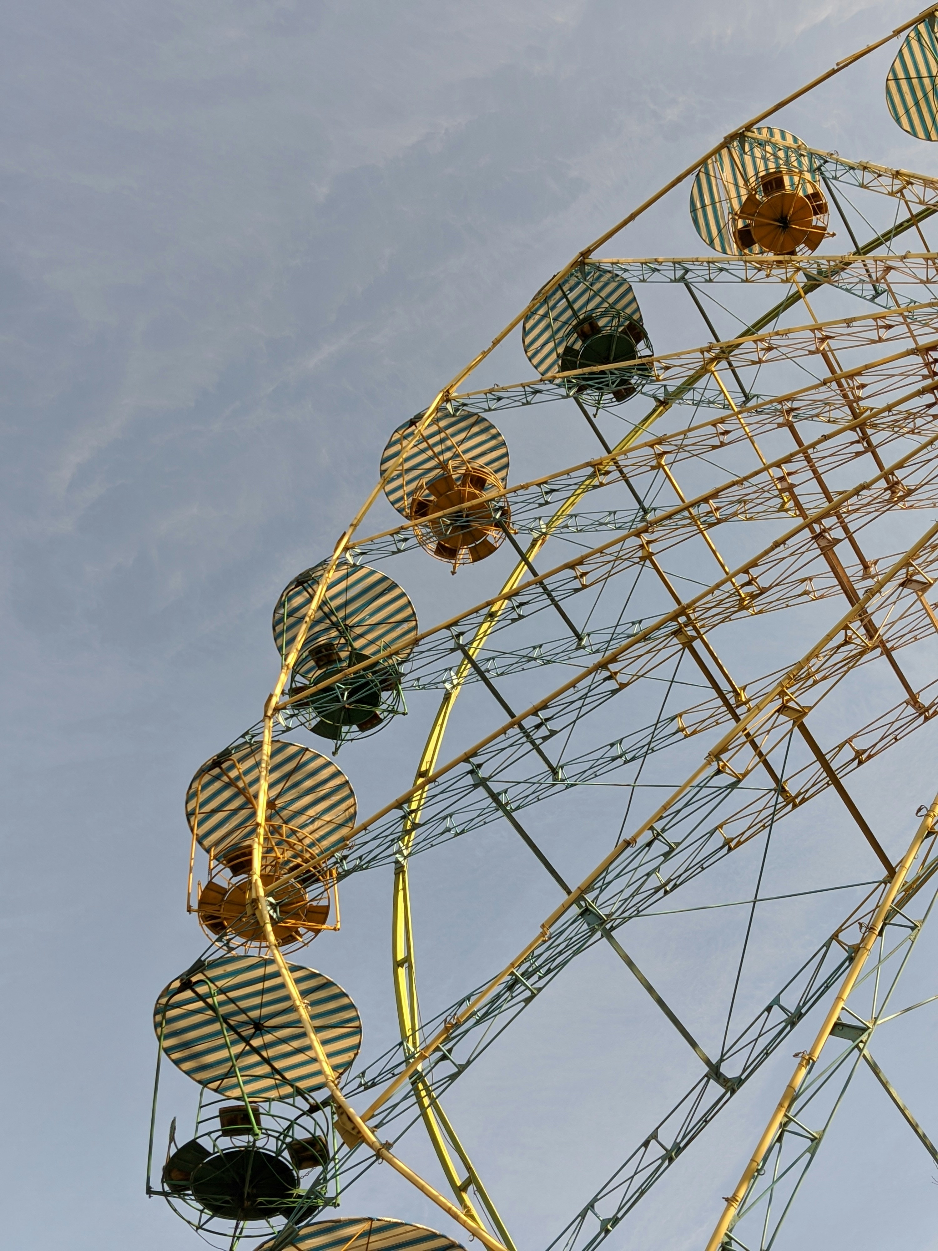a ferris wheel is shown against a blue sky