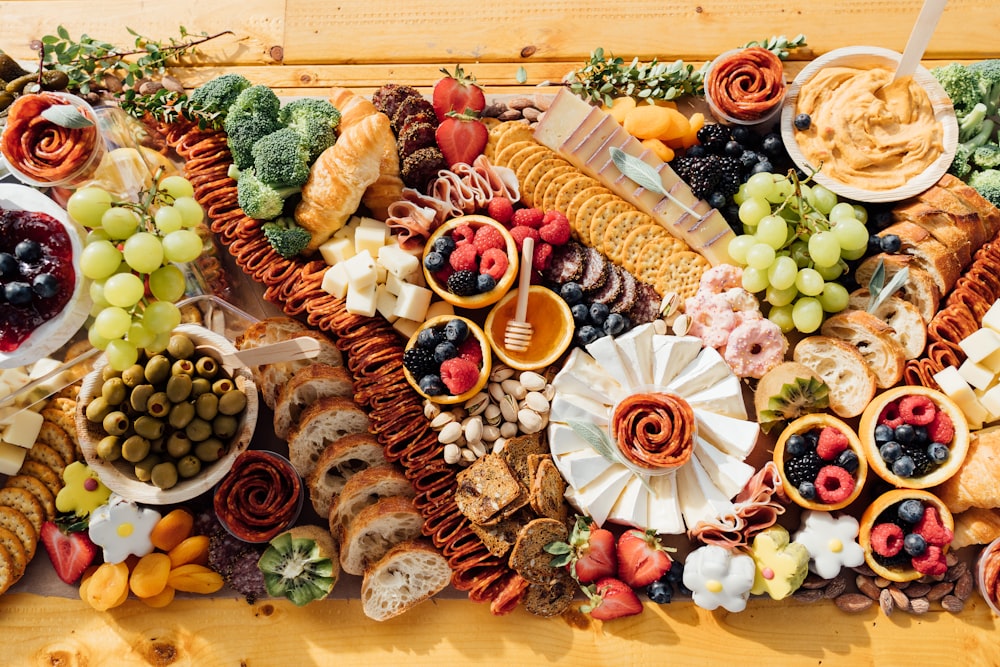 a wooden table topped with lots of different types of food