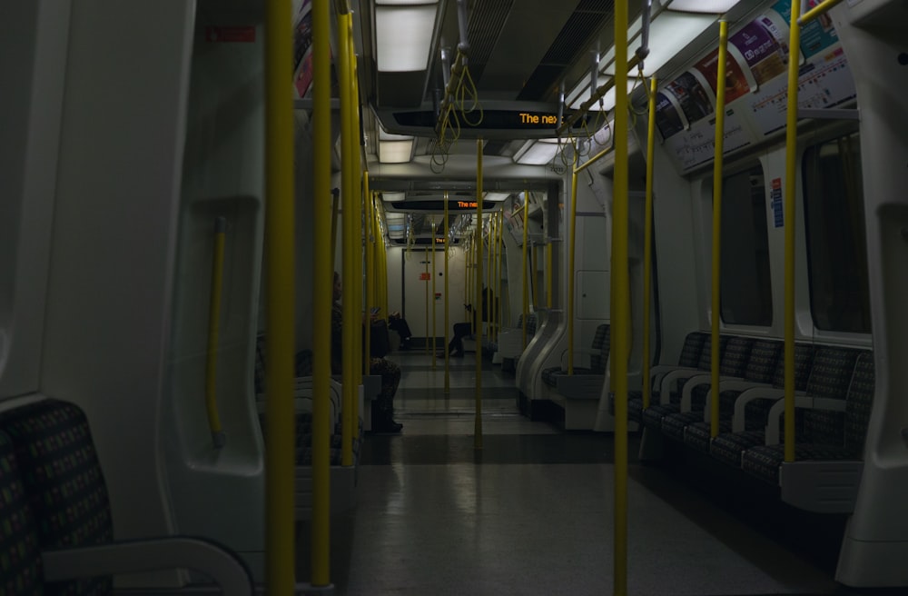 a subway car filled with lots of empty seats