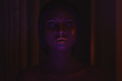 Artistic glitter bar makeup sparkling under soft lighting, perfect for parties.