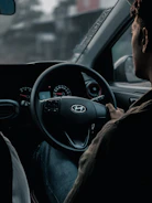 A focused student behind the wheel during an intensive driving lesson