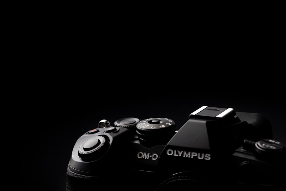 a close up of a camera on a black background