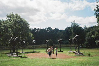 Public environment installation featuring large-scale abstract sculptures outdoors.