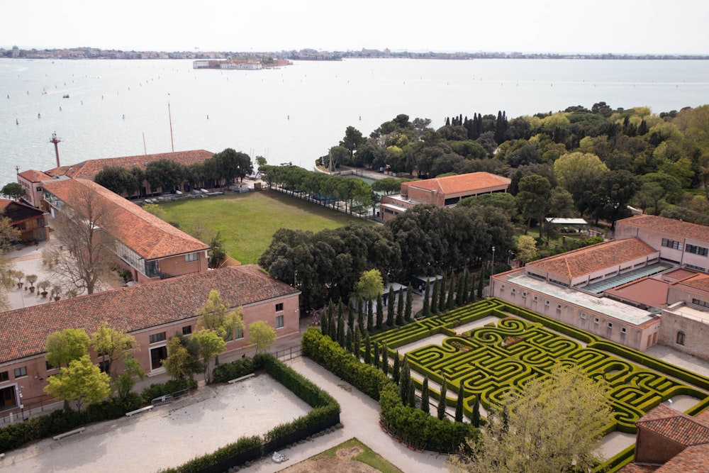 an aerial view of a building with a maze in the center