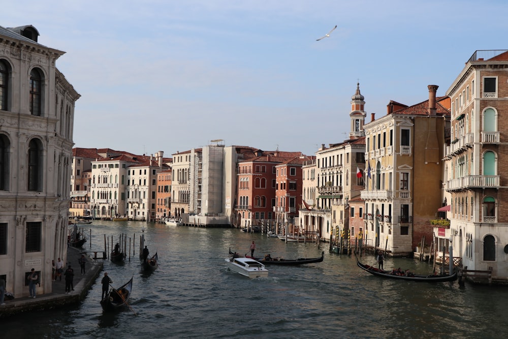 a waterway with gondolas and buildings on both sides
