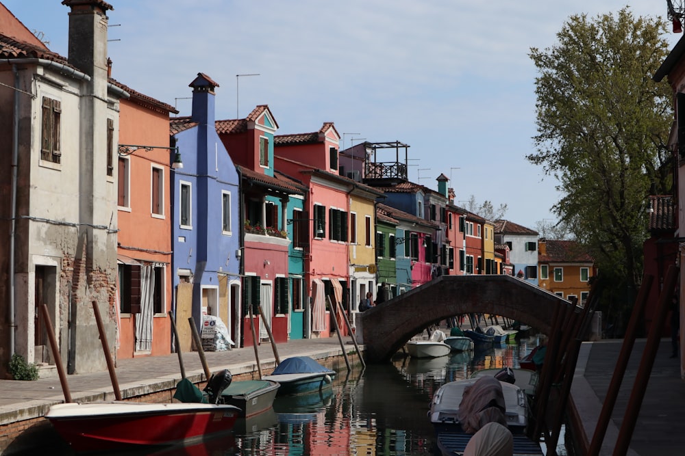 a row of houses next to a body of water