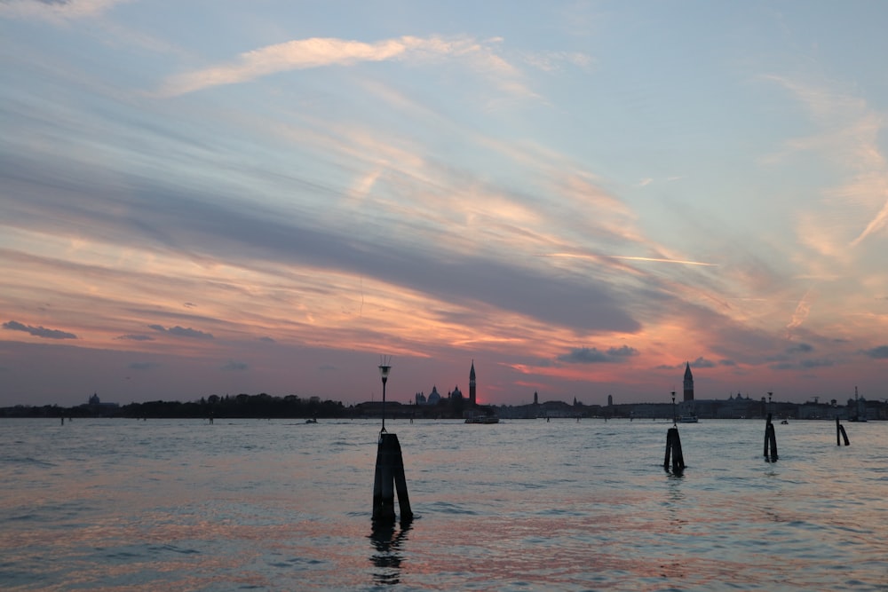 a body of water with a sky in the background