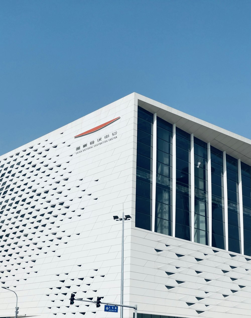 a large white building with a sky background