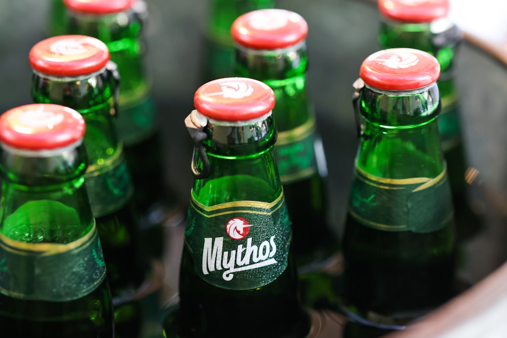 a close up of many bottles of beer