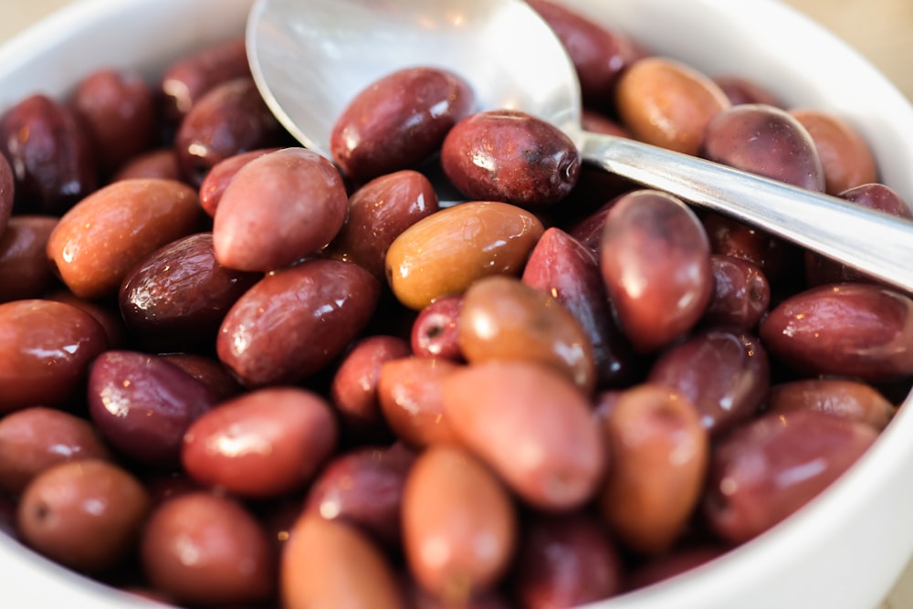 a bowl of beans with a spoon in it