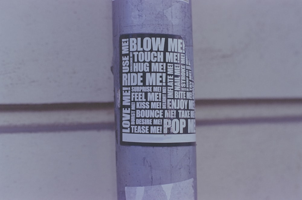 a purple sticker with words written on it