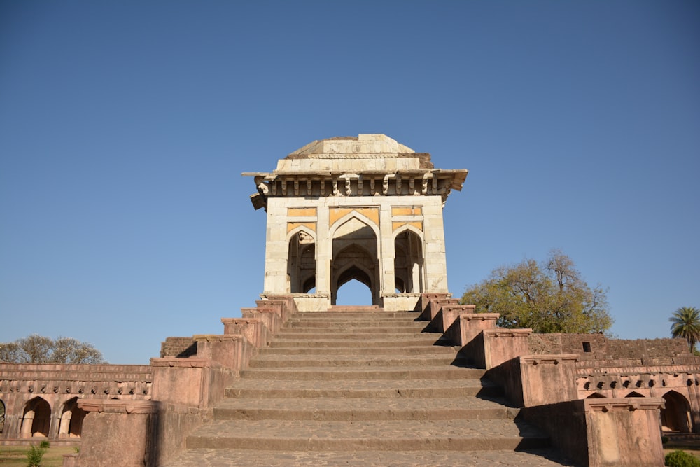 a stone staircase leading up to a tower