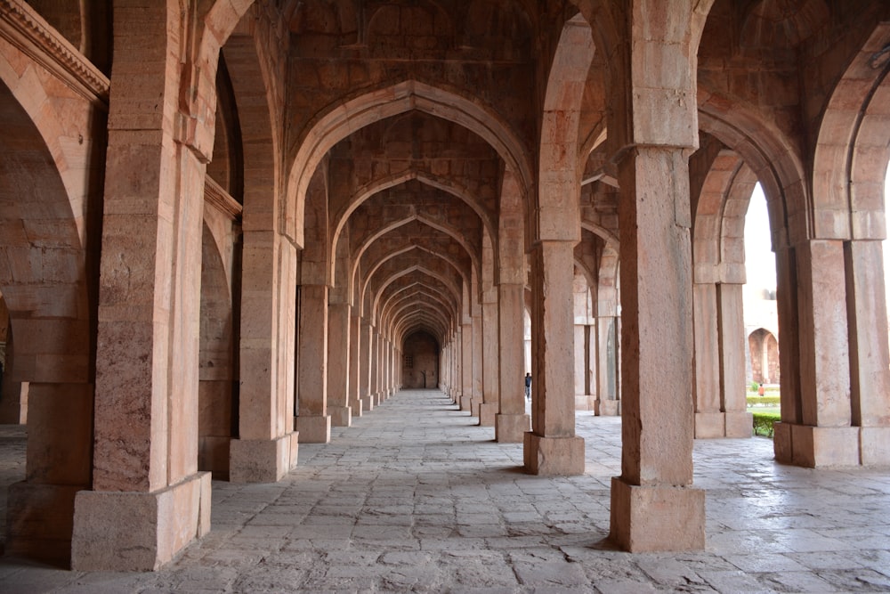 a row of arches and pillars in a building