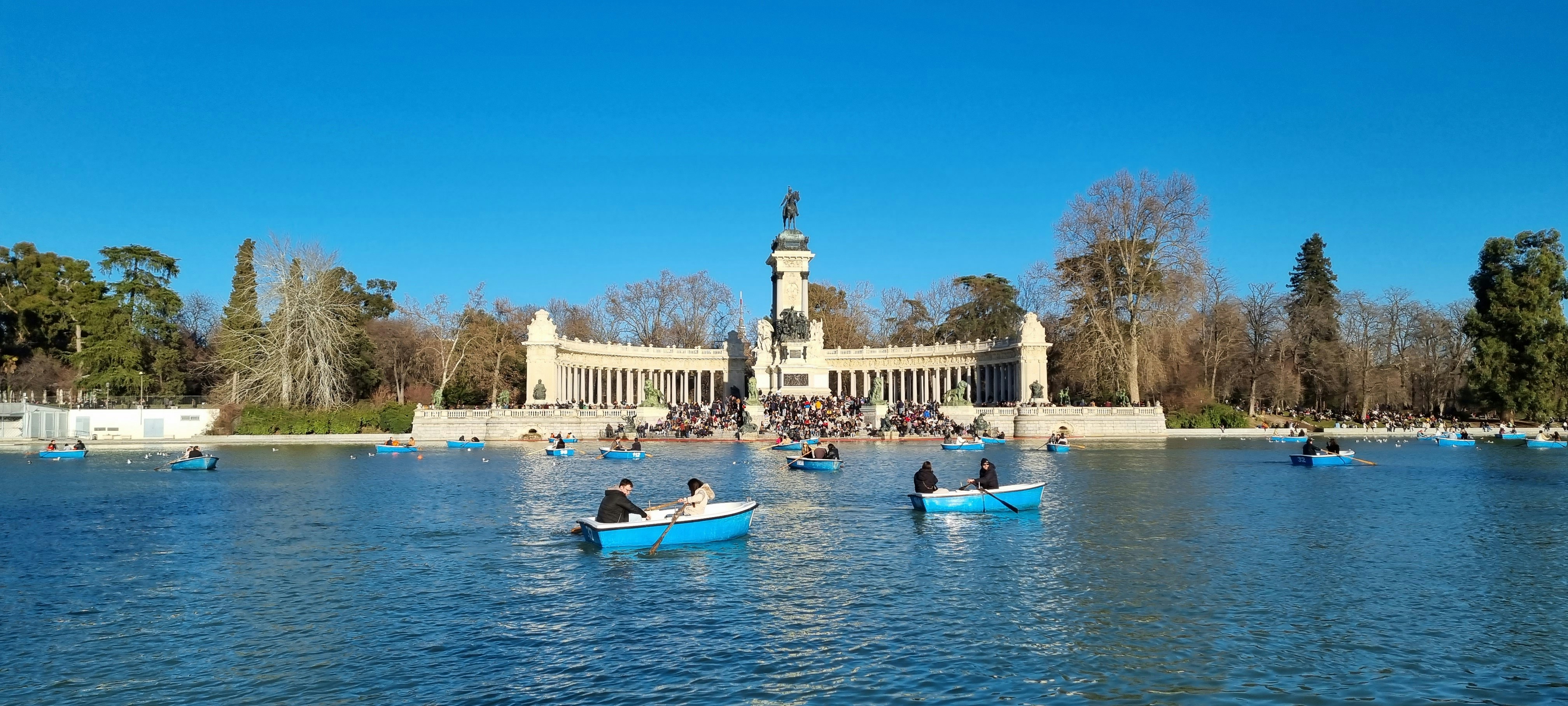 a group of people in small boats on a body of water