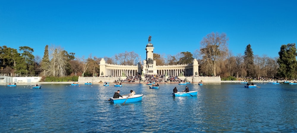 a group of people in small boats on a body of water