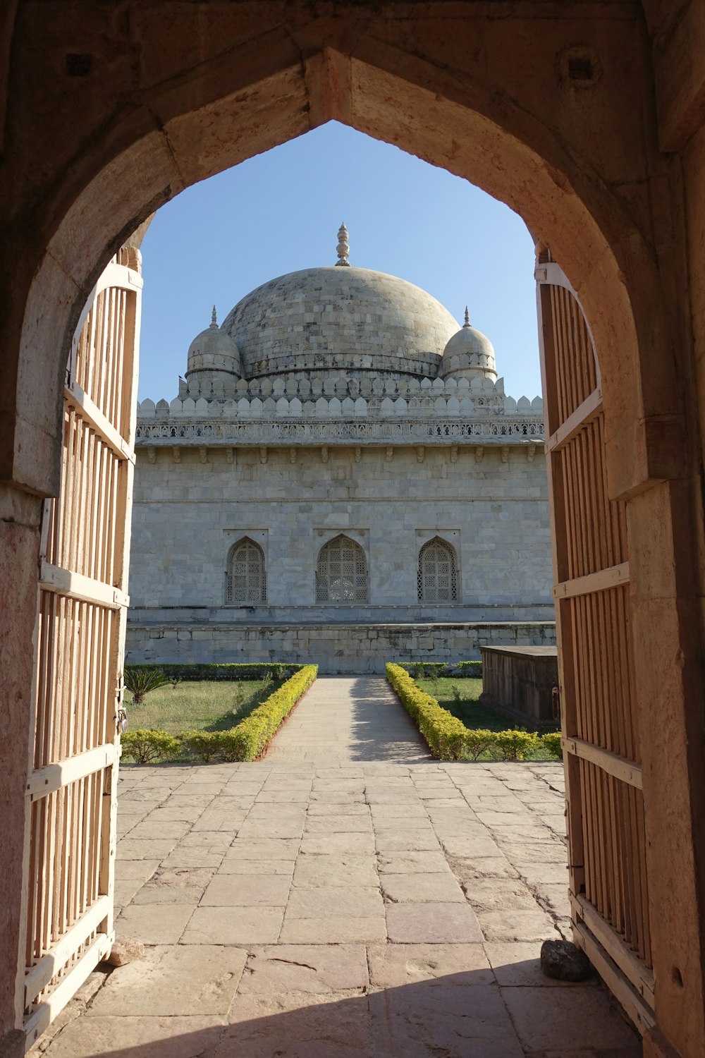 a view of a building through an archway