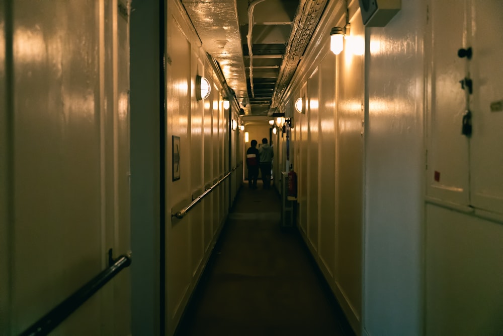 a long hallway with lights on both sides of it