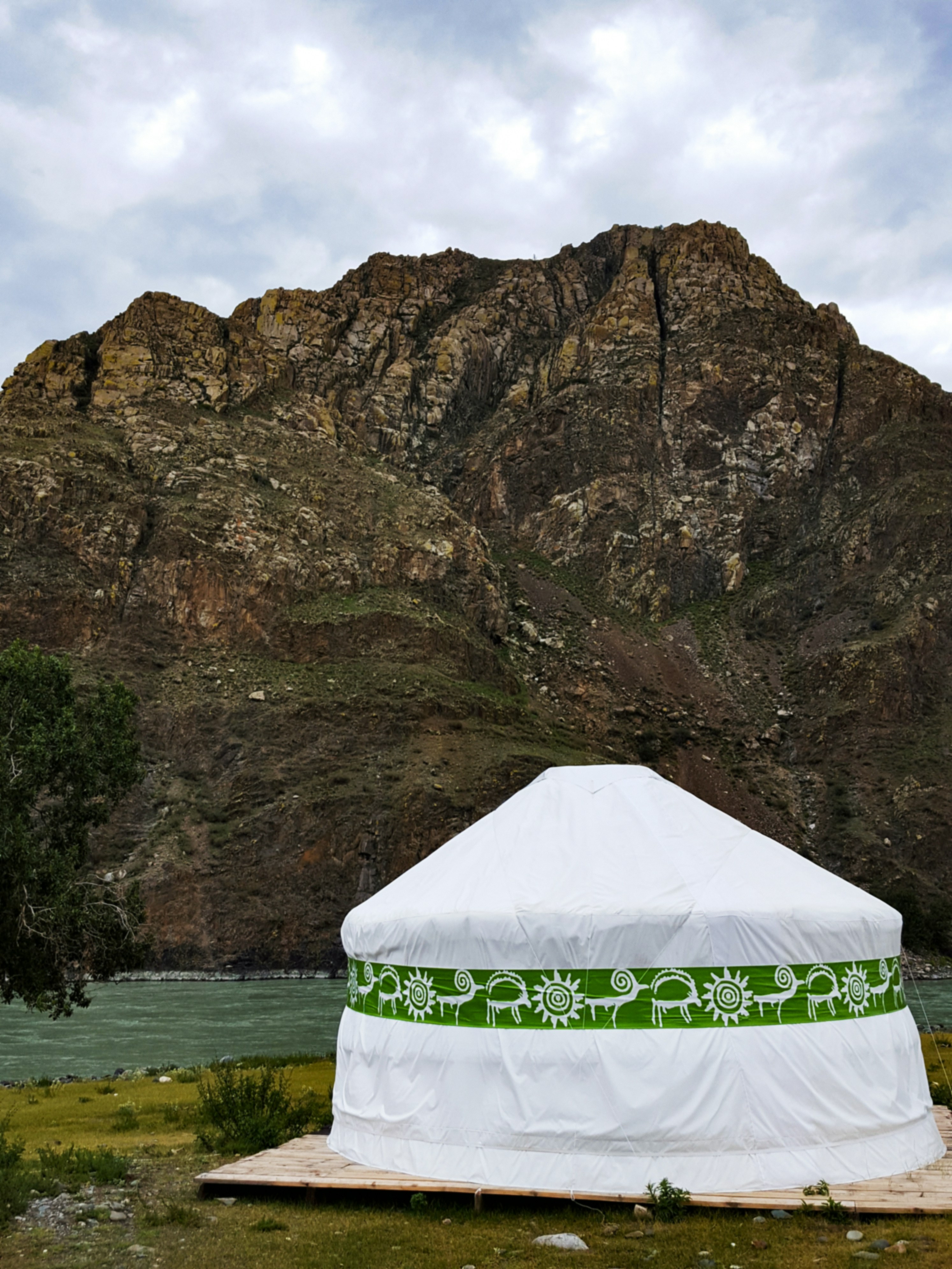 a yurt with a mountain in the background