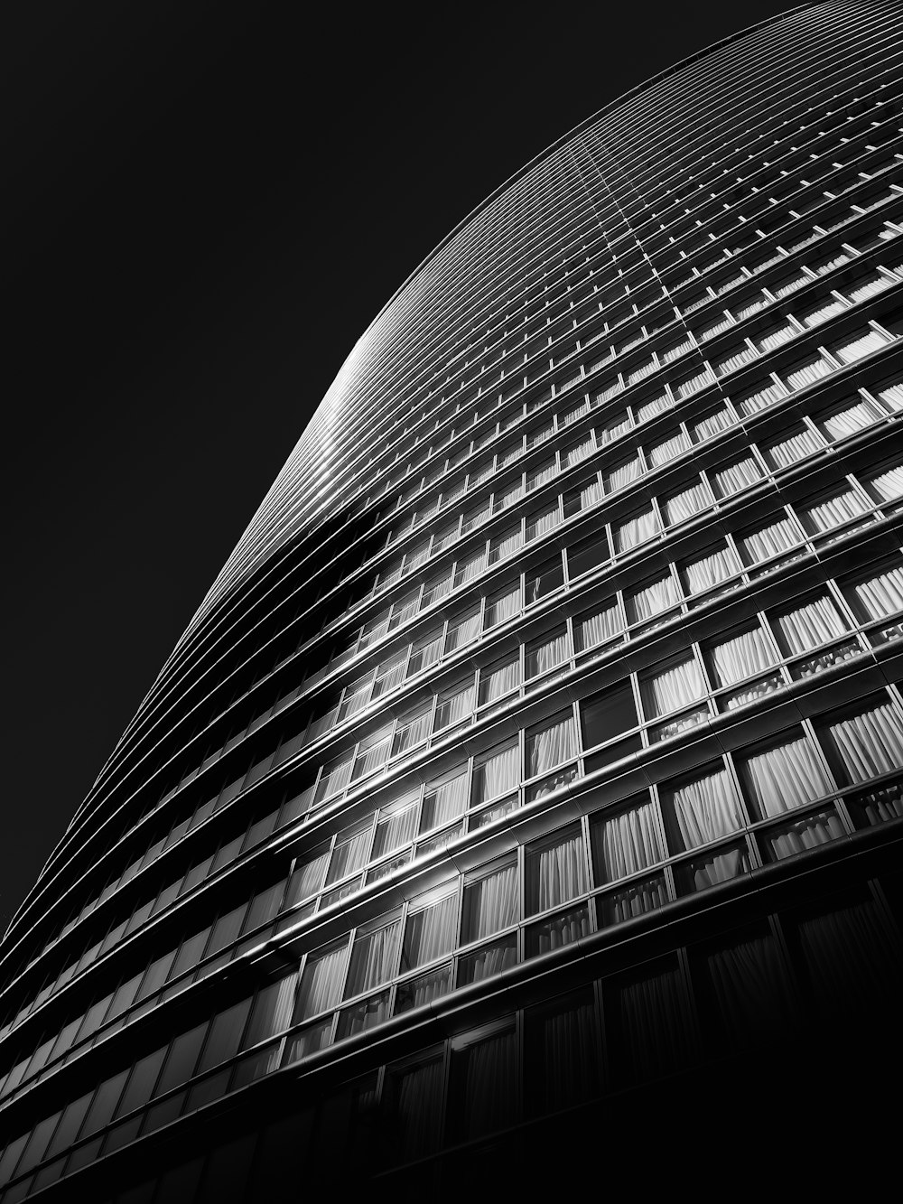 a black and white photo of a tall building