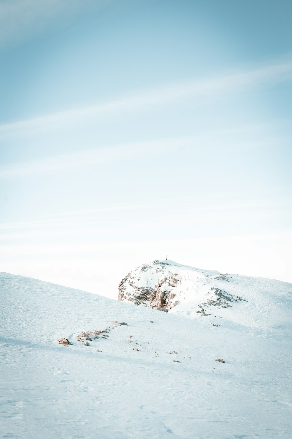 a man riding skis down a snow covered slope