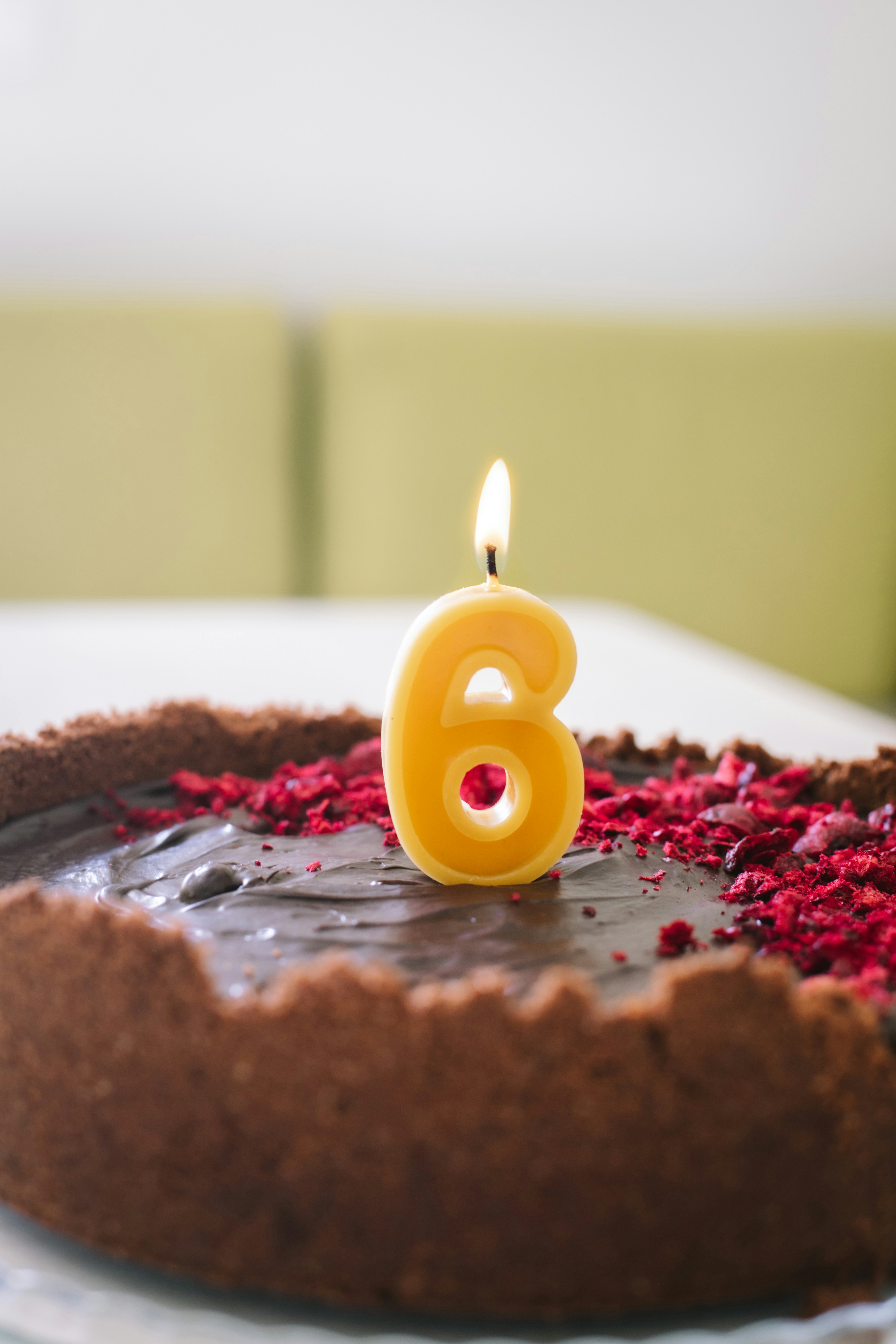 a chocolate cake with a candle on top of it
