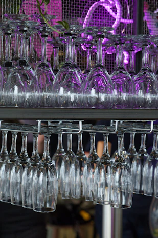 A chic hanging wine glass rack in a kitchen.