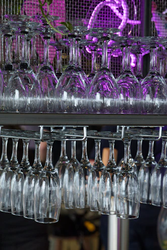 A chic hanging wine glass rack in a kitchen.