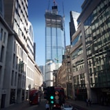 a city street filled with traffic and tall buildings