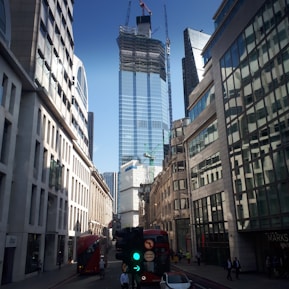 a city street filled with traffic and tall buildings