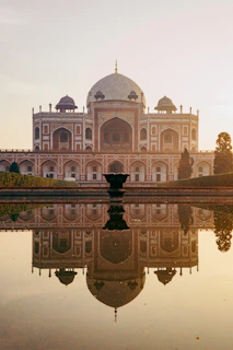 a reflection of a building in a body of water