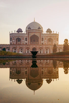 a reflection of a building in a body of water