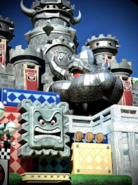 A vibrant castle built from blocora blocks displayed on a wooden table.