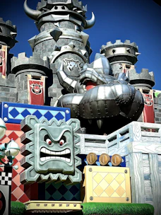 Brightly colored blocks arranged to form a playful castle with towers and flags.