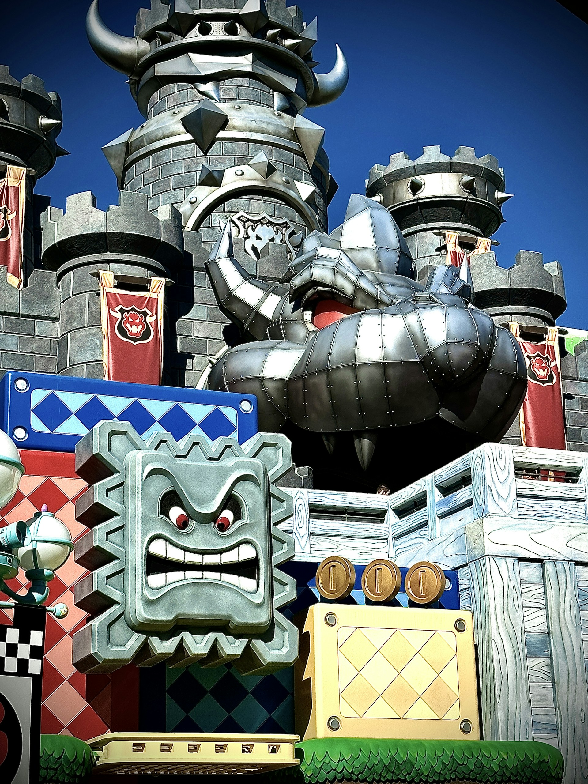 Screenshot of the game's building mechanics featuring a whimsical pig fortress under construction with humorous details.