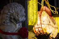 Festive lanterns and red envelopes surrounding a playful horse mascot representing bingwu.