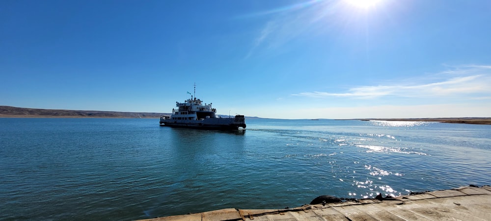 a large boat floating on top of a large body of water