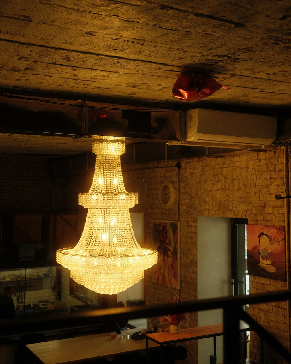 a chandelier hanging from a ceiling in a room