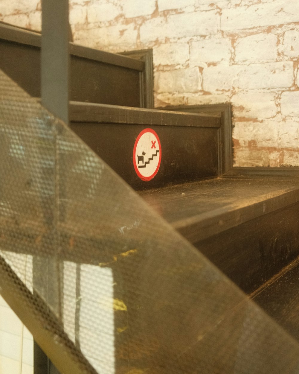 a close up of a set of stairs with a sign on it