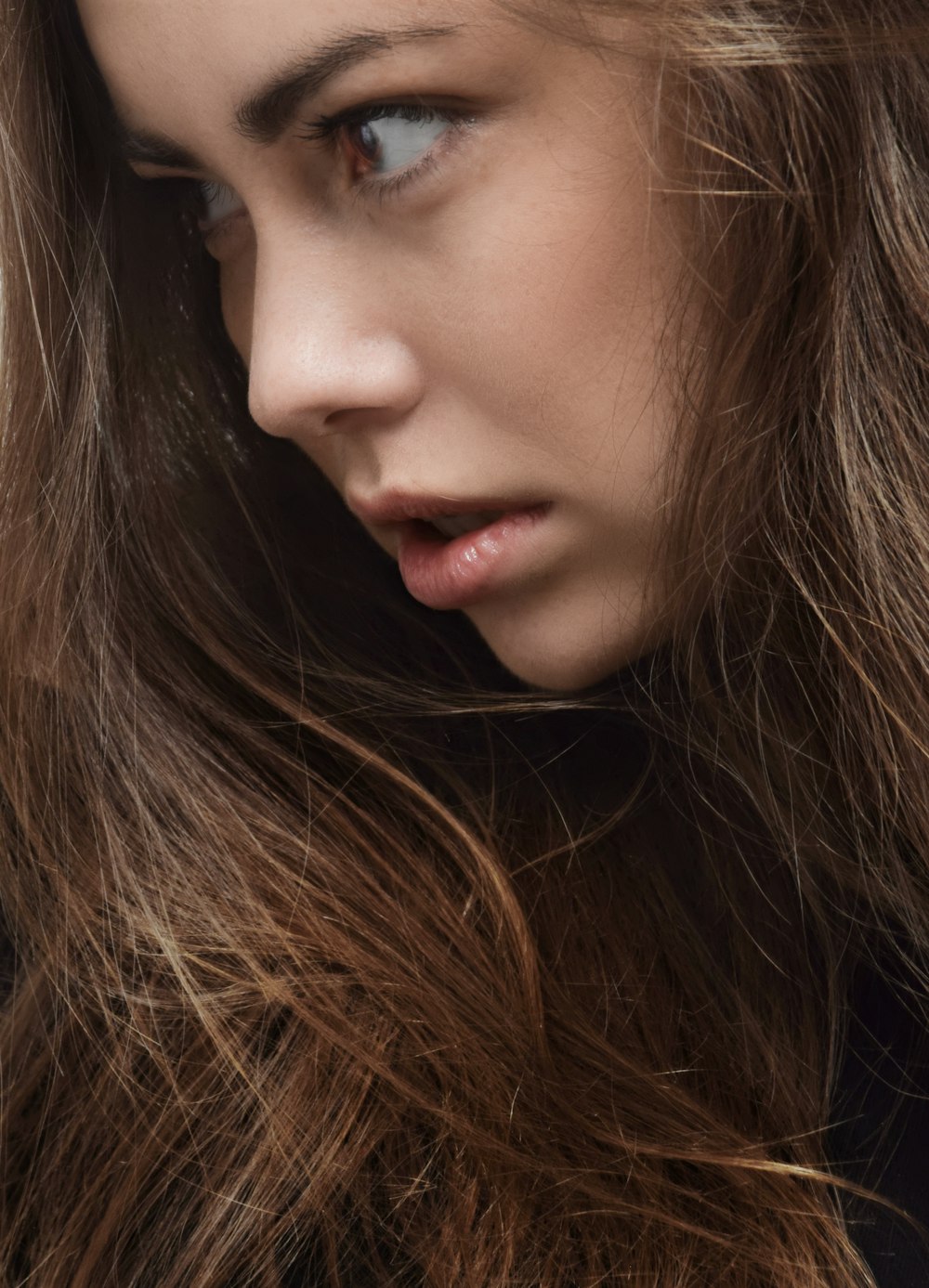 a close up of a woman with long hair