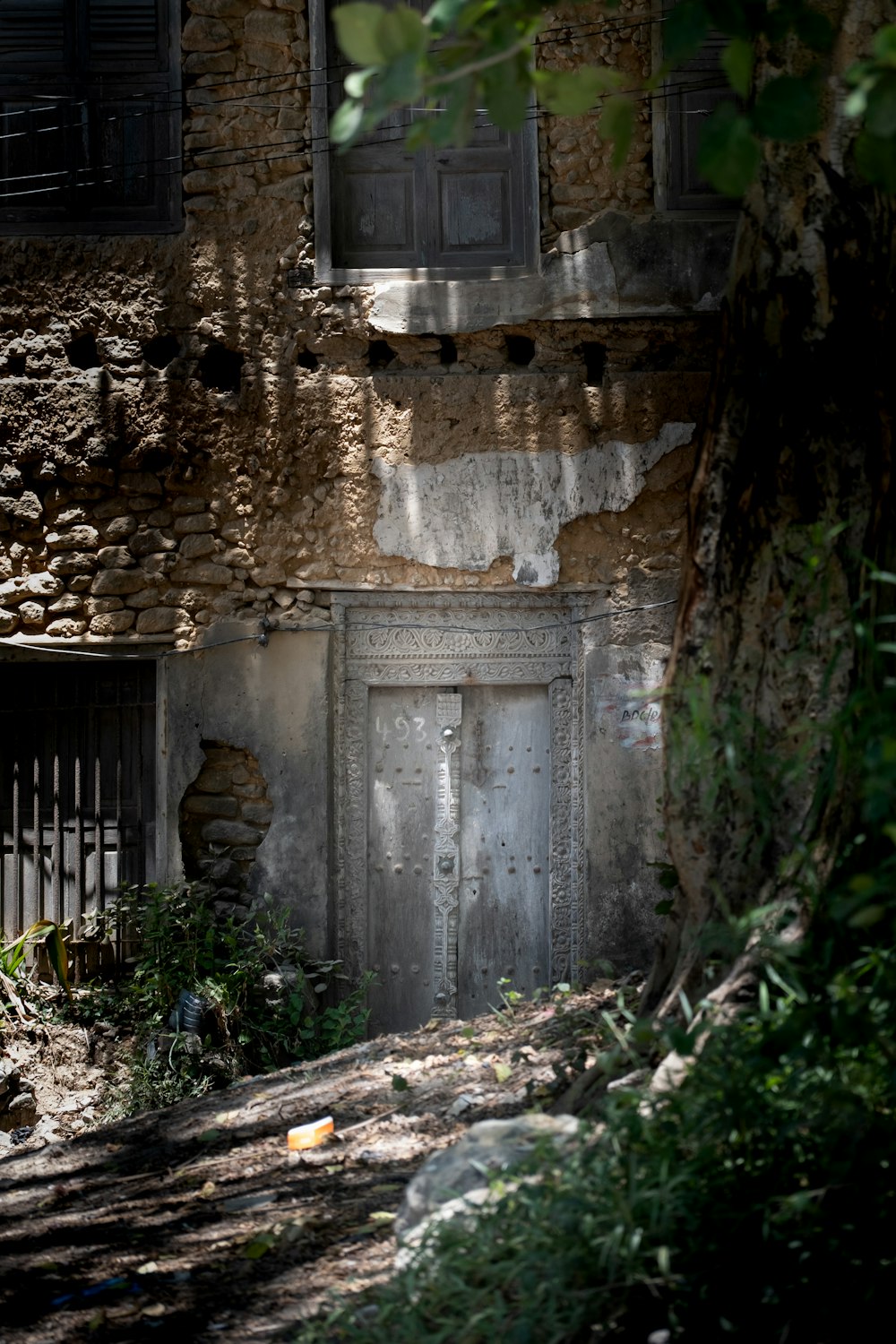 a stone building with a door and window