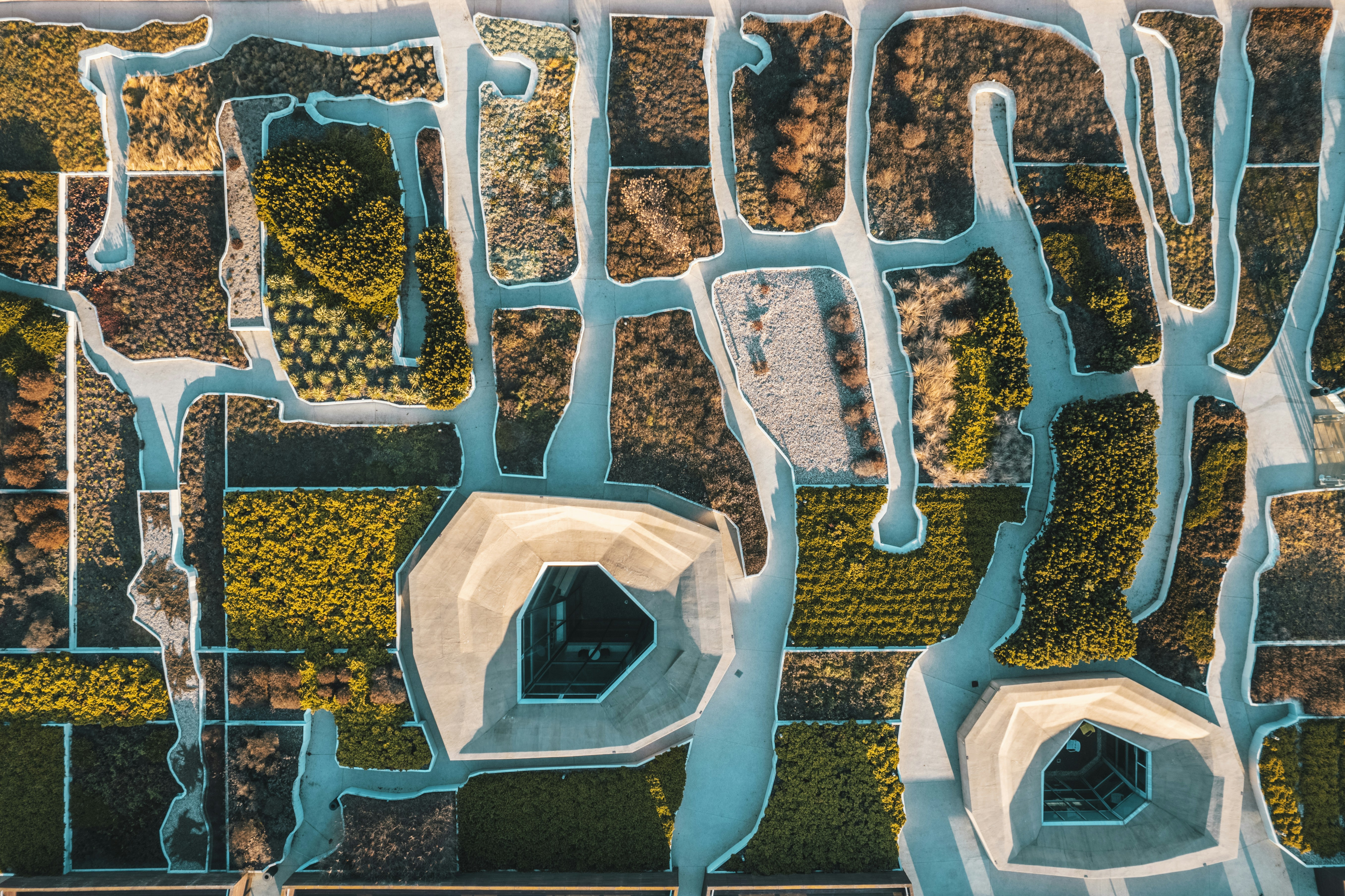 an aerial view of a river and land